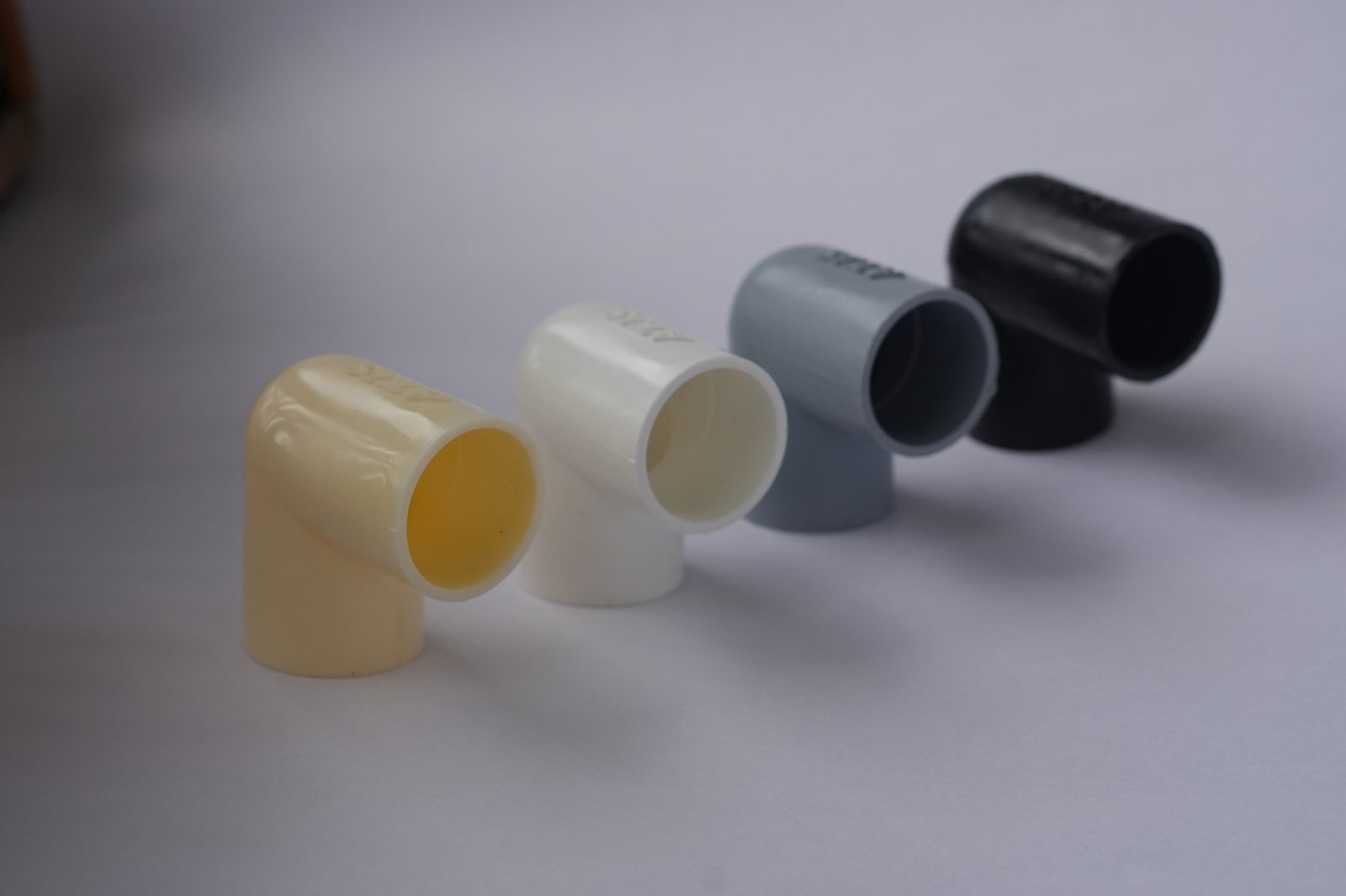 Matha PVC 90 degree conduit elbow in ivory, white, grey and black